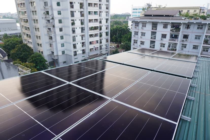 Large commercial solar panel array on flat roof